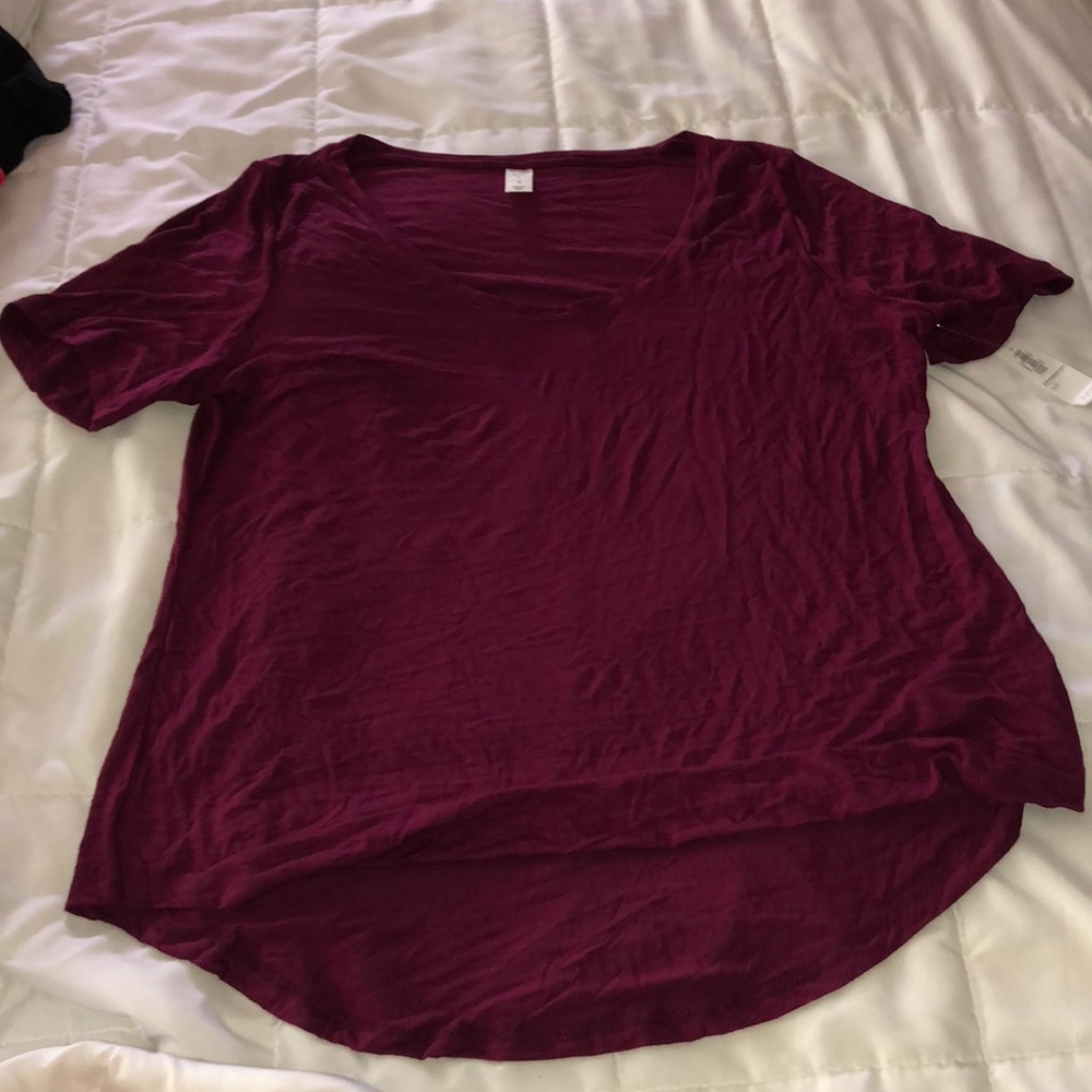 Women’s maroon shirt.